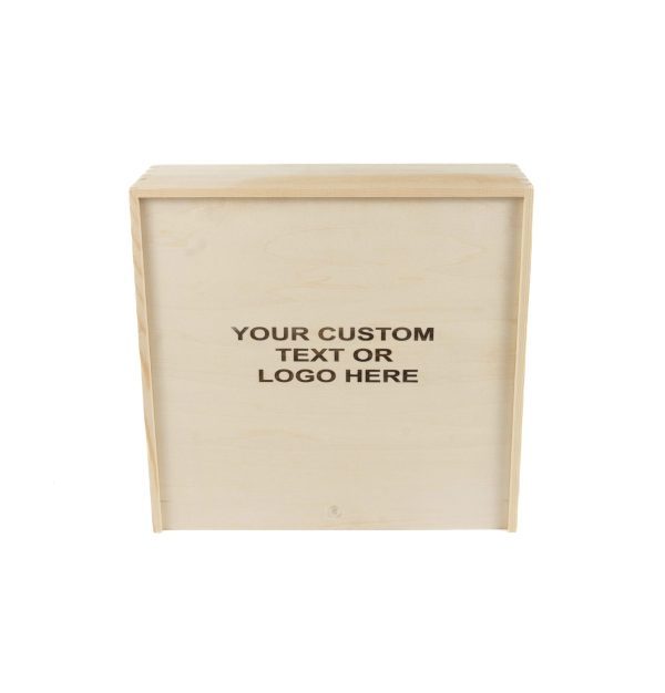 Displayed is the Wooden Gift Box - Large Crate, featuring the text "YOUR CUSTOM TEXT OR LOGO HERE" printed in black on the front panel. The box has a light, natural wood finish and a rectangular shape with smooth edges, resembling a small crate. The background is plain white.