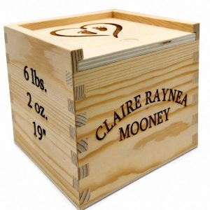 Personalized baby keepsake box made of wood with custom engraved birth information for a new baby gift.