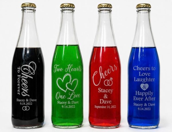 Personalized 12oz glass wedding favor bottles with custom logo engraving and gold lids.